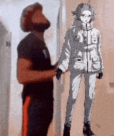 a man is standing next to a drawing of a woman