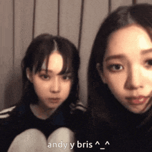 a couple of girls standing next to each other with the words andy y bris written on the bottom