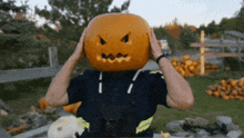 a man with a pumpkin carved into his head
