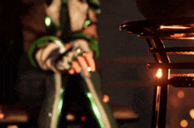 a person in a green and white outfit is standing next to a stool