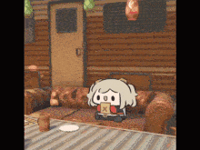 a cartoon character is sitting on a couch holding a box