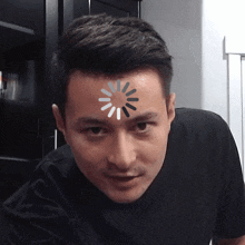 a man with a loading icon on his forehead
