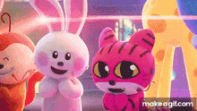 a group of stuffed animals standing next to each other and smiling .