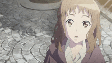 a close up of a girl 's face with a brick walkway in the background