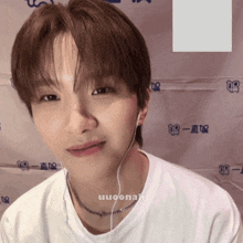 a close up of a person 's face with a watermark that says uuoona