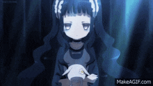 a girl with long black hair is holding a stuffed animal and says makeagif.com in the corner