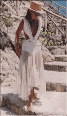 a woman wearing a white dress and a straw hat with the words it 's summer written below her