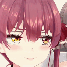 a close up of a girl 's face with red hair