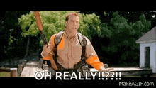 a man is holding a gun in his hand and saying `` oh really '' .