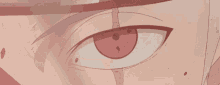 a close up of a person 's eye with a red spot on it