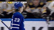 a hockey player with the number 23 on their jersey