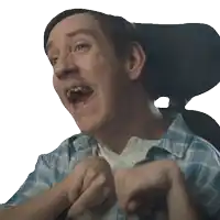 a man in a plaid shirt is sitting in a wheelchair