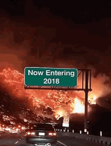 a sign that says now entering 2018 is above a highway