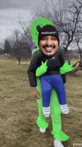 a man in a multiverse costume is carrying a child