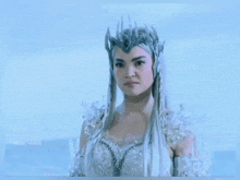 a woman is wearing a crown and a costume that says mite