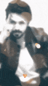 a blurry picture of a man with a heart in the middle