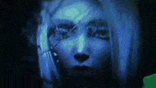 a close up of a woman 's face with blue light behind her