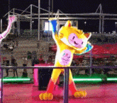 a mascot for the rio 2016 olympics is standing on a stage