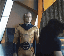a man in a yellow and black superhero costume