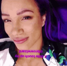 a close up of a woman 's face with purple hair and the words little touch up by browwizard
