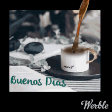 a picture of a cup of coffee with the words buenos dias on it