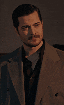 a man in a suit has a lightning bolt coming from his face