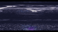 a blurry picture of a tv screen with a purple glow in the middle of it .