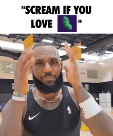 a man with a beard wearing a black nike tank top screams if you love