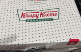 a box of krispy kreme doughnuts with polka dots on it