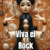 a picture of a doll with the words " viva el rock " on it