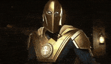 a man wearing a helmet and armor with an ankh on his chest