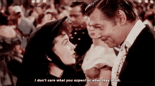 a man and a woman are looking at each other and the woman says i don 't care