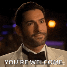 a man in a tuxedo and bow tie says you 're welcome