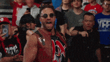 a man wearing sunglasses and a shirt that says yee
