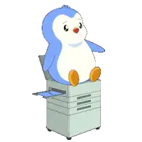 a blue and white penguin is sitting on a printer