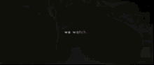 a close up of a woman 's face with the words we watch behind her