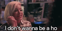 a woman is talking on a cell phone and saying i don t wanna be a ho .