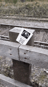 a wooden post has a sticker on it that says ' fisherman 's coal '