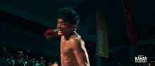 a poster for kahar shows a shirtless boxer in a boxing ring
