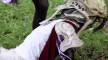 a person wearing a costume with a swirl on the shoulder