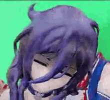 a close up of a person 's face with purple hair and a green background .