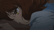 a close up of a girl laying on a bed with her eyes closed