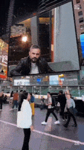 a billboard with a picture of a man on it says abc on it