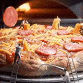 a pizza with pepperoni cheese and tomatoes is being prepared