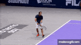 a man is playing tennis on a court with a sign that says transform tomorrow