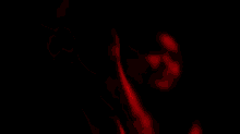 a blurry picture of a person in a red light