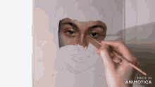 a person is painting a woman 's face with a brush and the words made in animotica on the bottom