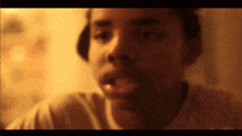 a blurry picture of a man 's face with a hat on his head