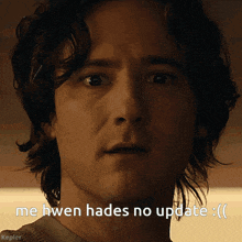 a close up of a man 's face with the words me hwen hades no update written below him