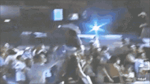 a blurry picture of a crowd of people with the words rbd.gif on the bottom